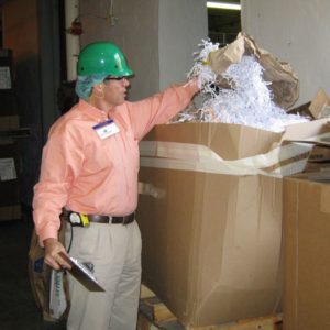 Kahley Malloy, the owner of Cumberland Recycling, assists with industrial recycling services 