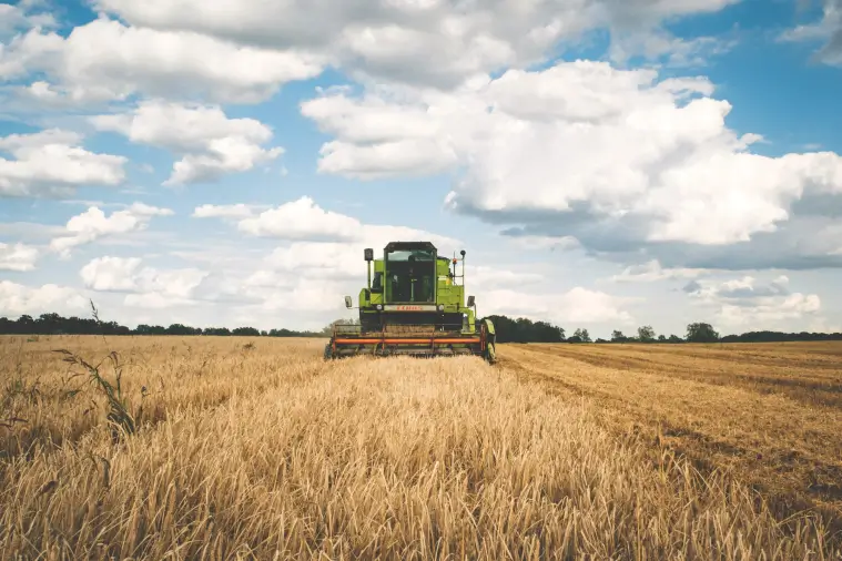 A tractor in a field creating recyclable commodities