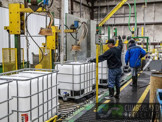 Employees balancing financial and environmental performance in facility recycling