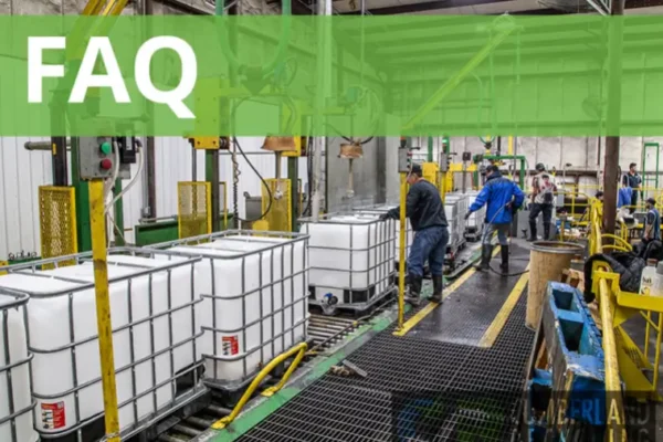 Workers on a production line filling large industrial containers in Cumberland Recycling's factory