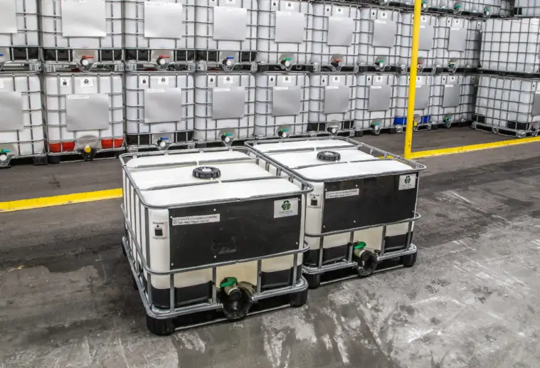 A large warehouse showcasing multiple large containers and fiber drums in Franklin, Tennessee