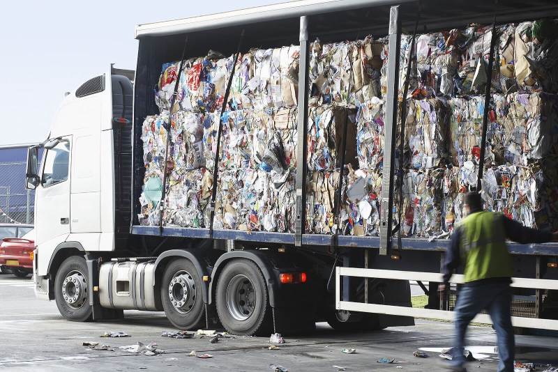 Truck loaded with compressed bales of industrial waste at a recycling facility in Franklin, TN